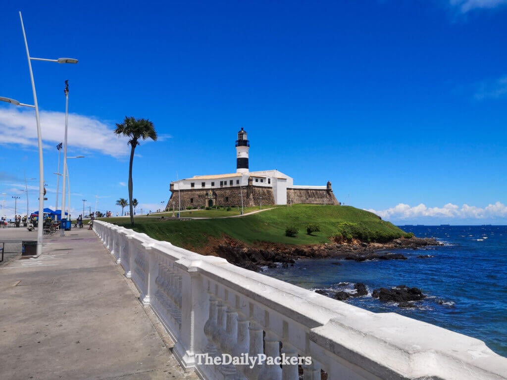 Farol da Barra lighthouse in Salvador standing on a grassy headland, one of the city’s most iconic coastal landmarks