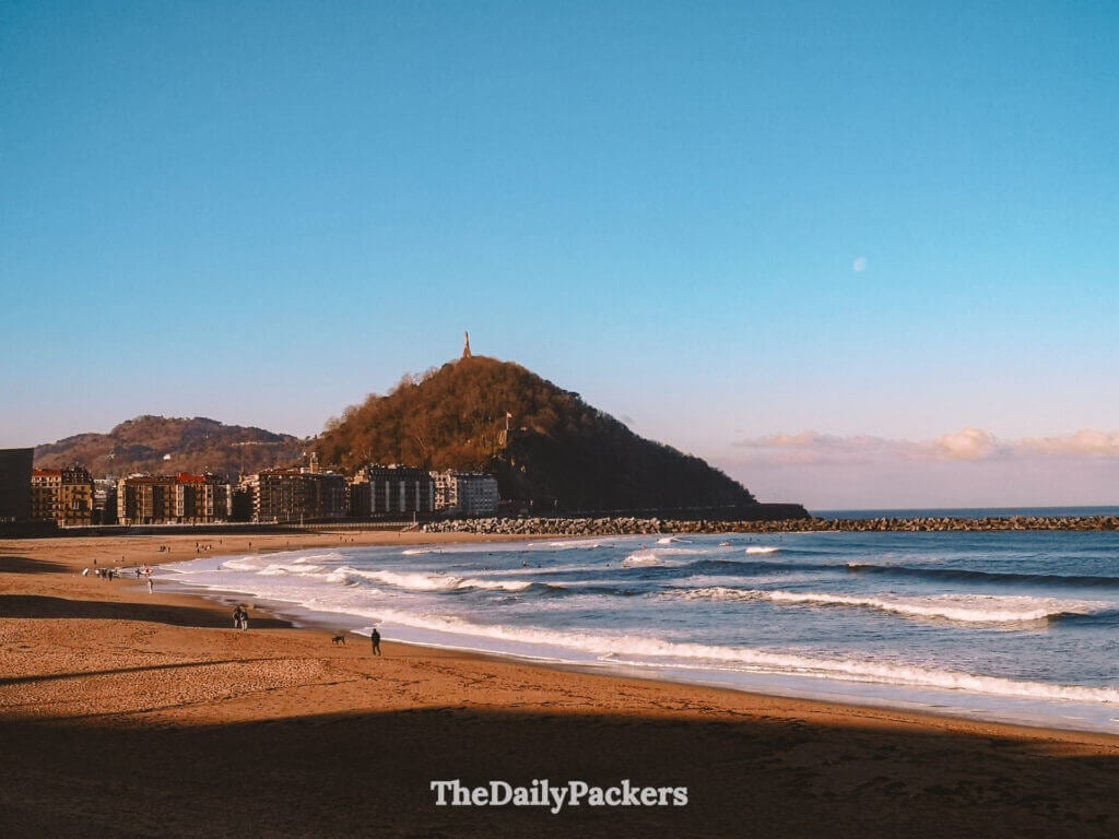 La Concha Beach in San Sebastián with golden sand, gentle waves, and Monte Urgull backdrop