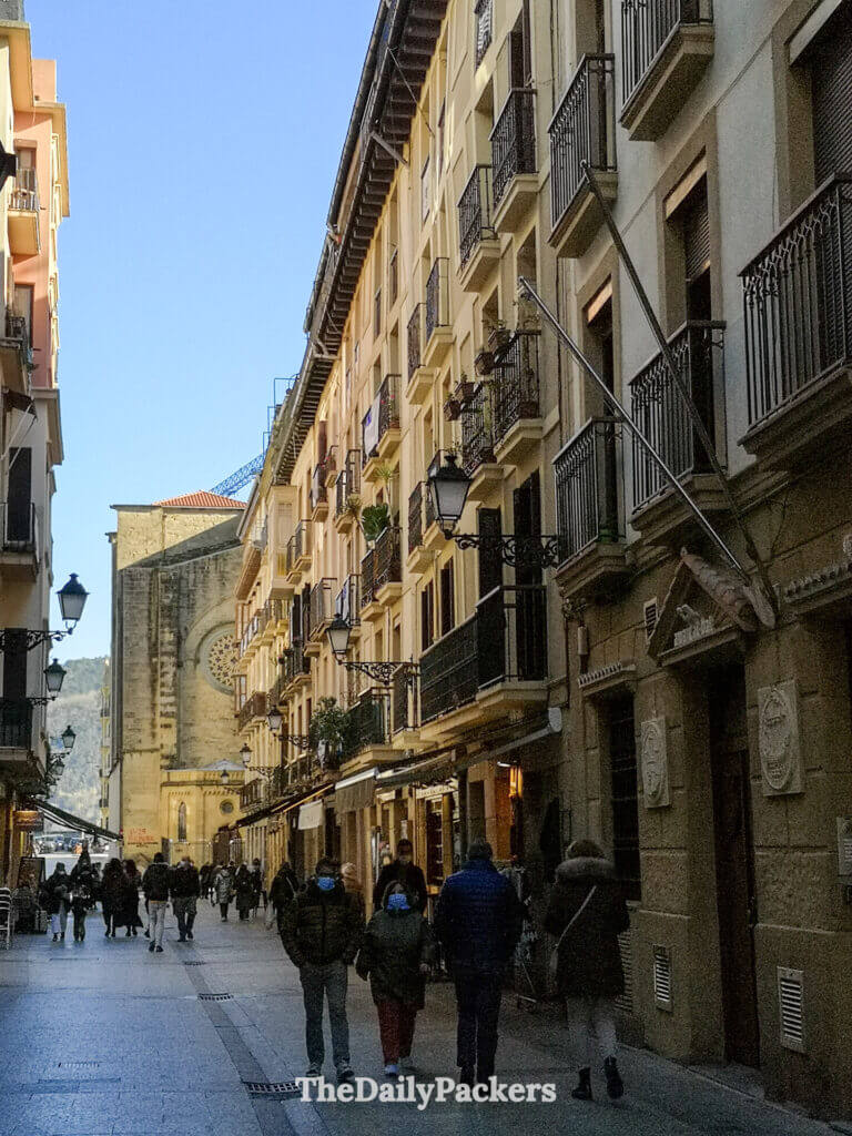 Lively street in San Sebastián old town with historic buildings and pedestrian