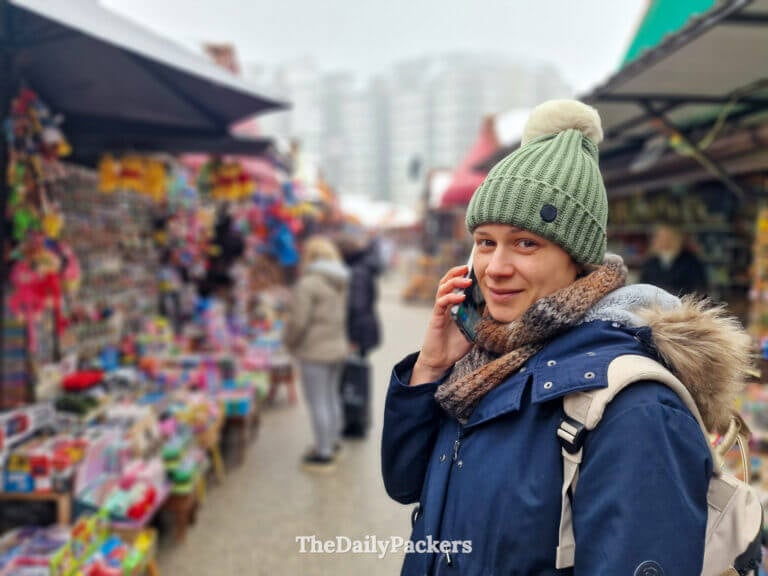 Making a WhatsApp call with Holafly eSIM while exploring Zlatibor local market