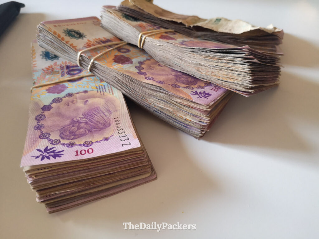 Stack of money in Argentina, peso banknotes used for cash payments