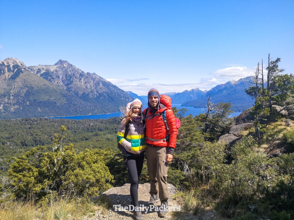 Couple at Cerro Llao Llao viewpoint overlooking Nahuel Huapi Lake in Bariloche