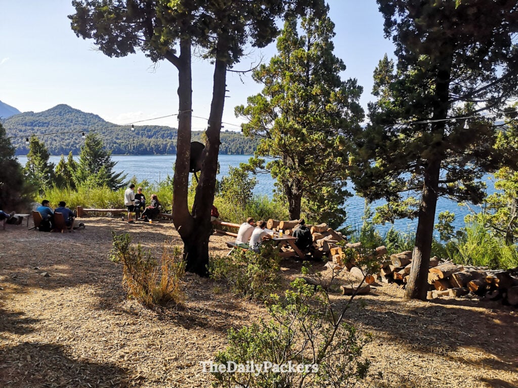 Outdoor garden at Patagonia Beer Factory overlooking Nahuel Huapi Lake in Bariloche