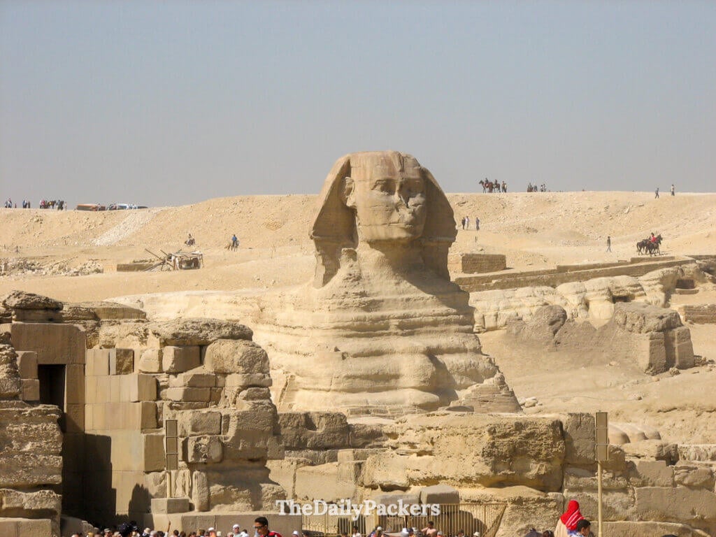 Close view of the Great Sphinx of Giza surrounded by ancient stone ruins in Egypt
