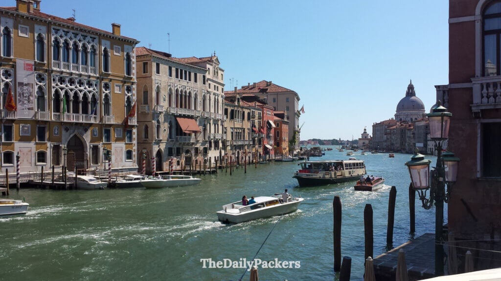 Grand Canal view with boats and Santa Maria della Salute church in Venice