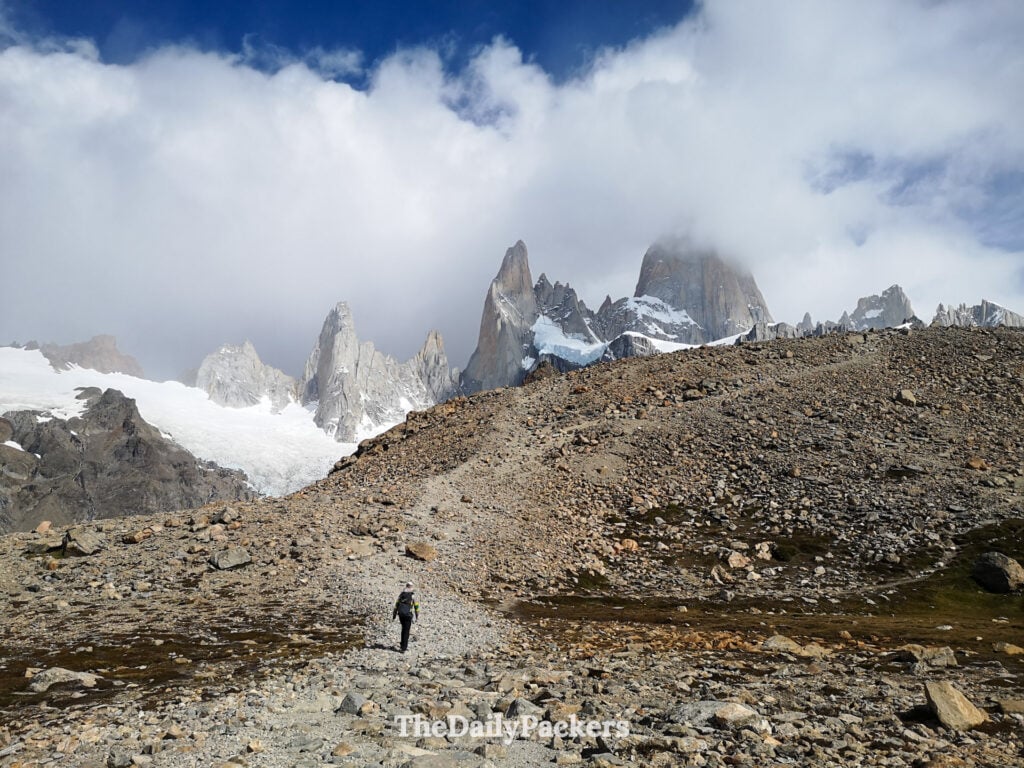 Hiker on last ridge before Laguna de los Tres with Fitz Roy peaks