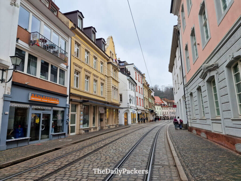 Tram street in Freiburg old town lined with traditional colorful houses