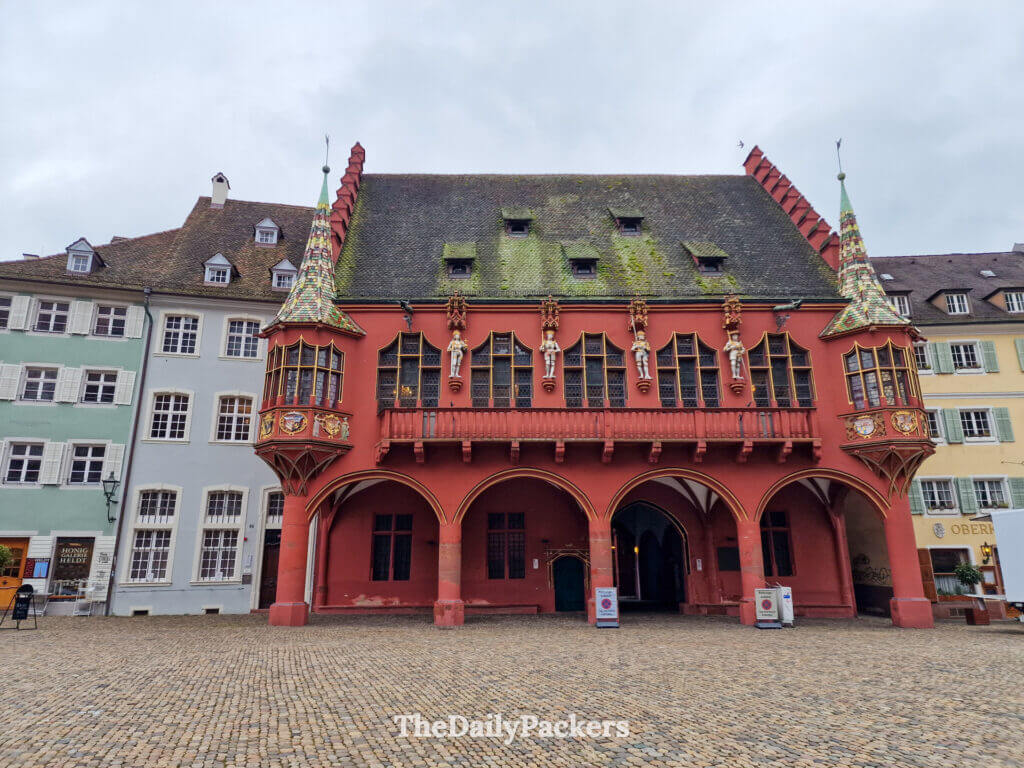 Historical Merchants’ Hall on Münsterplatz, colorful Renaissance building in Freiburg