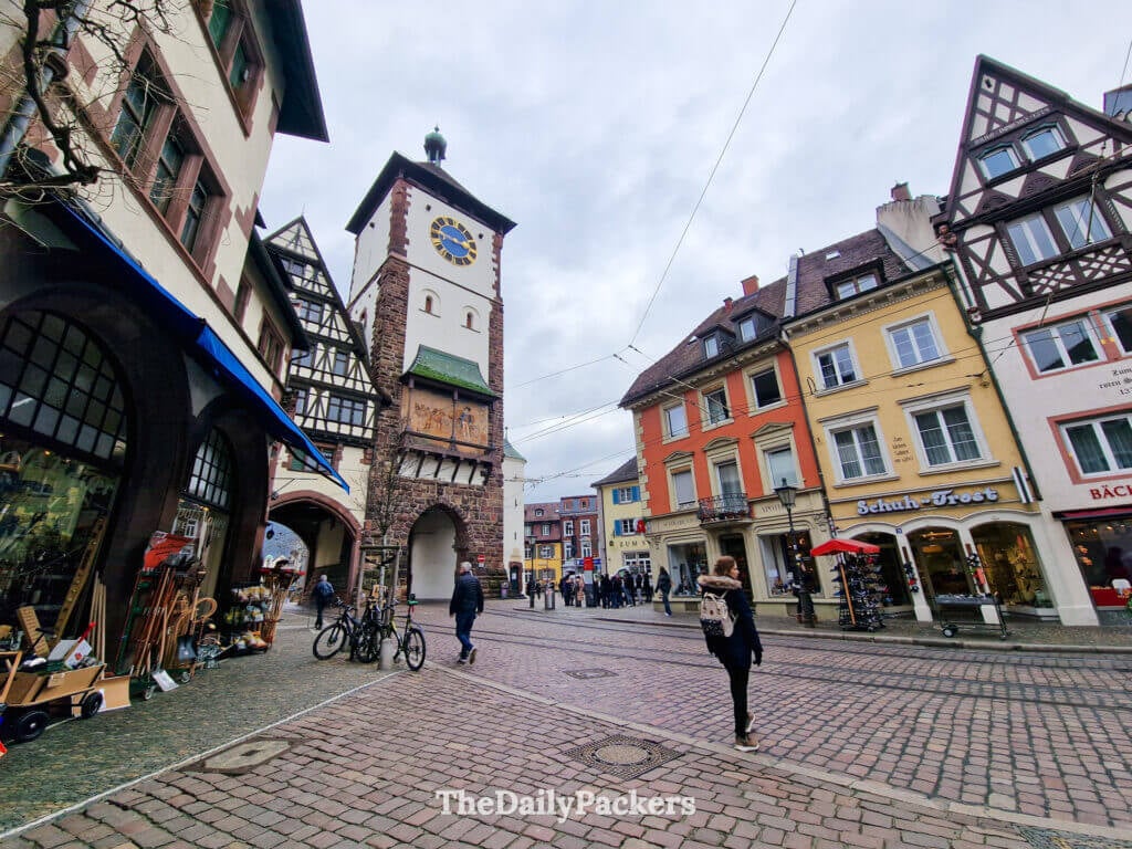 Schwabentor medieval gate in Freiburg with half-timbered houses and shops