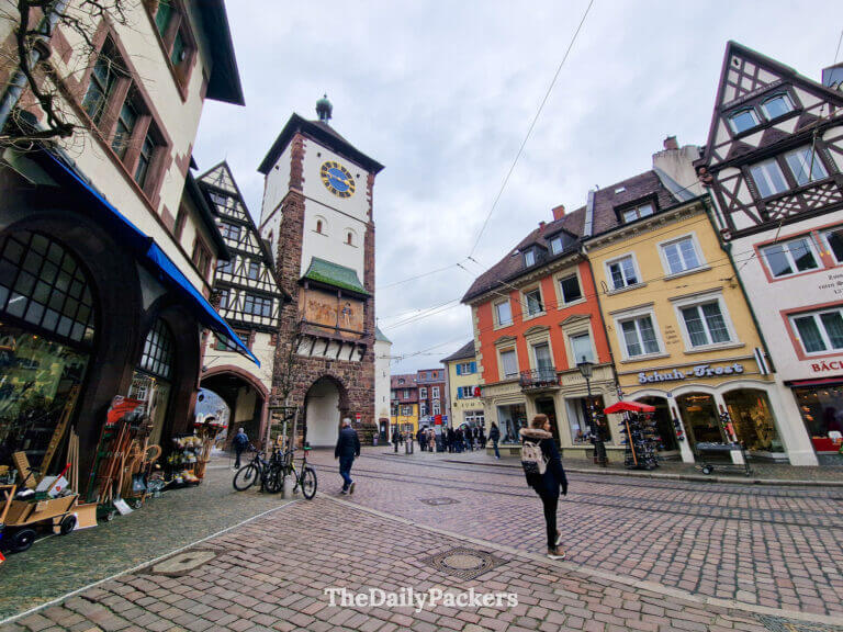 Schwabentor medieval gate in Freiburg with half-timbered houses and shops