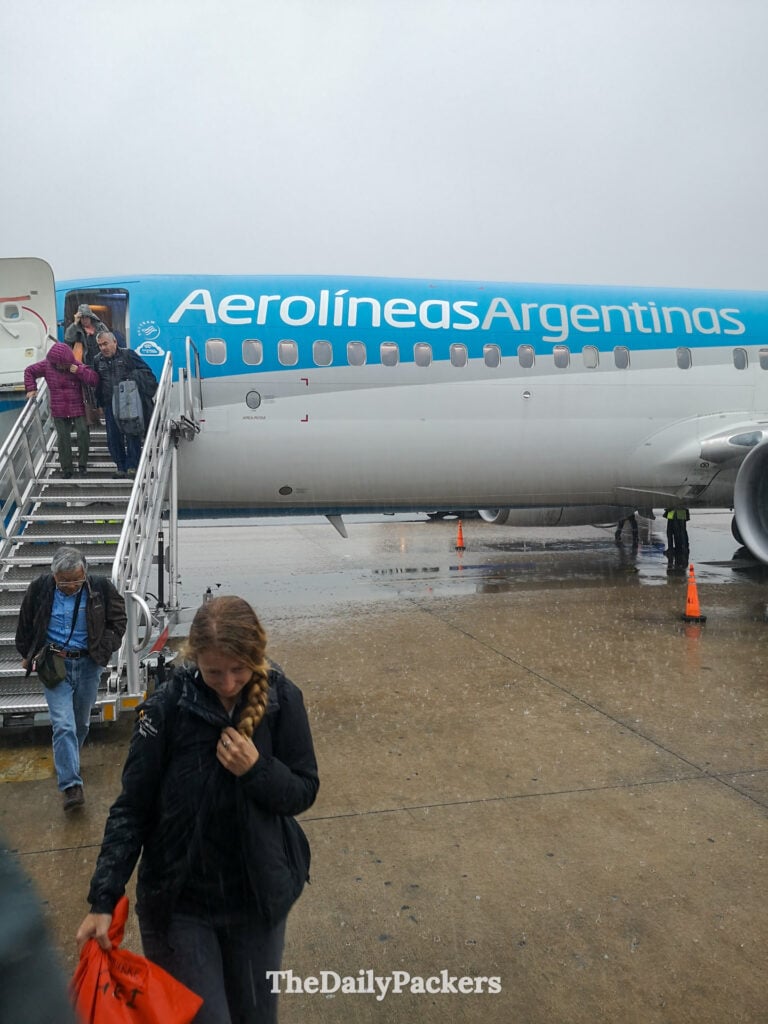 Passengers disembarking Aerolíneas Argentinas plane at Ushuaia Airport