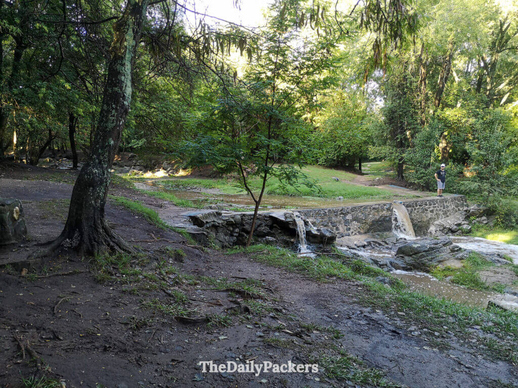 Small waterfall along Paseo de los Arroyos, a popular nature walk in Villa General Belgrano