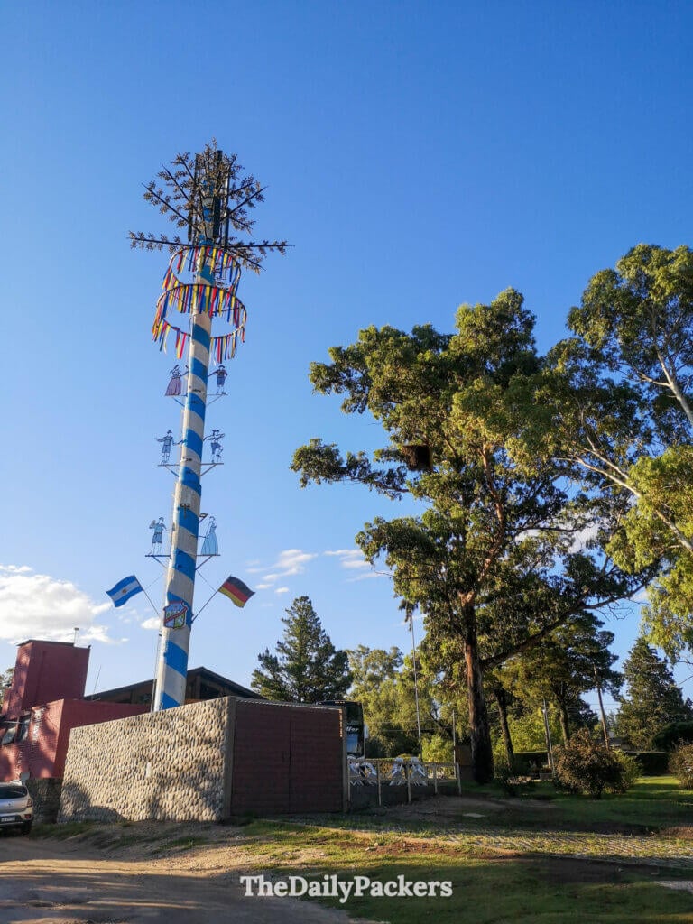 Decorated radio tower landmark in Villa General Belgrano with Argentine and German flags