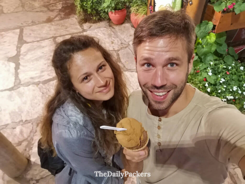 Couple eating local ice cream at night in Villa General Belgrano town center
