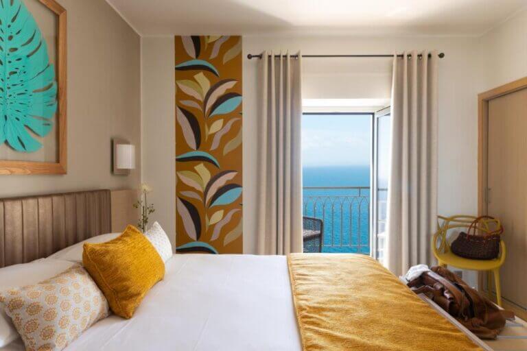A cozy and elegant bedroom at Hotel Santa Teresa in Bonifacio, one of the Best Hotels in Corsica