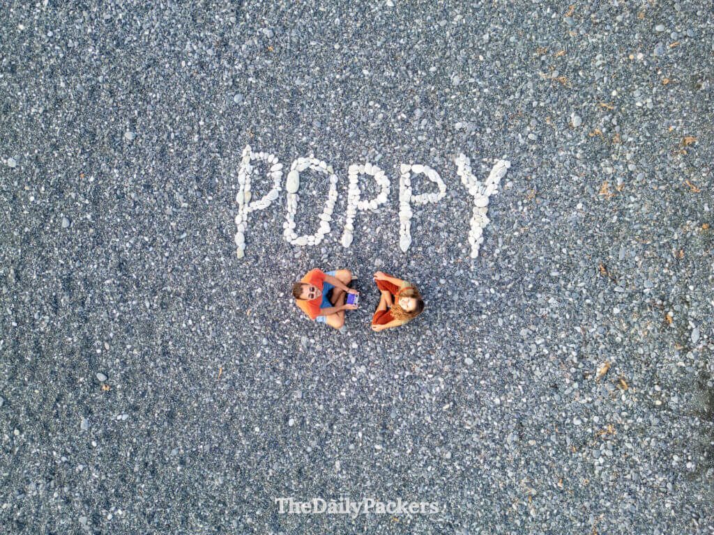 Poppy letters made of white pebble on Nonza beach to remember a stillborn boy