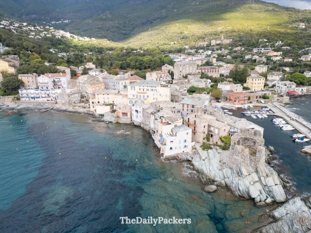 Drone shot of the historic Genoese tower ruin on the rocky point of Erbalunga in Corsica.