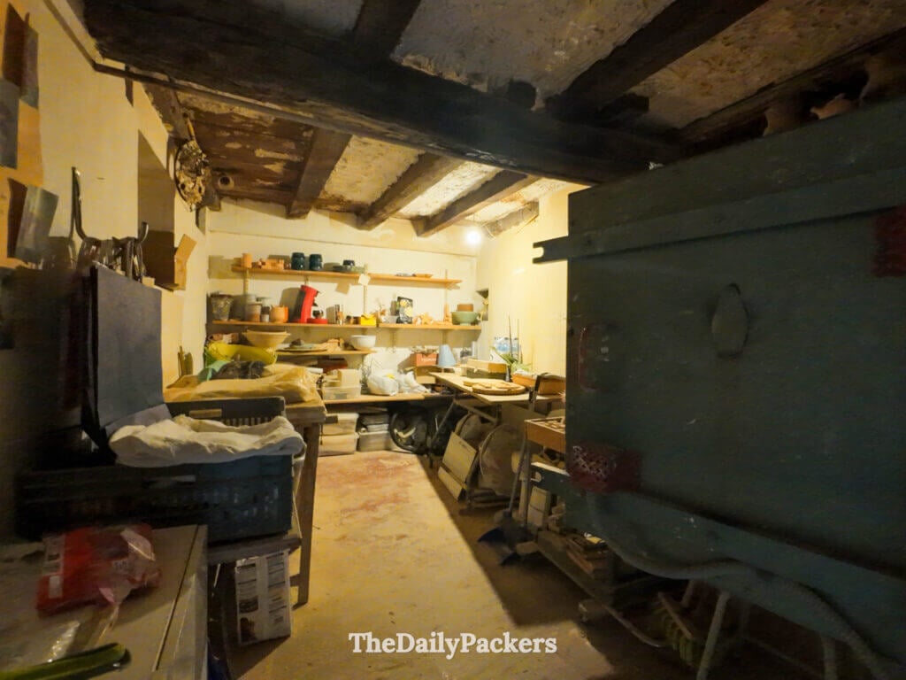 Inside a traditional artisan pottery workshop with clay pots in Corte, Corsica.