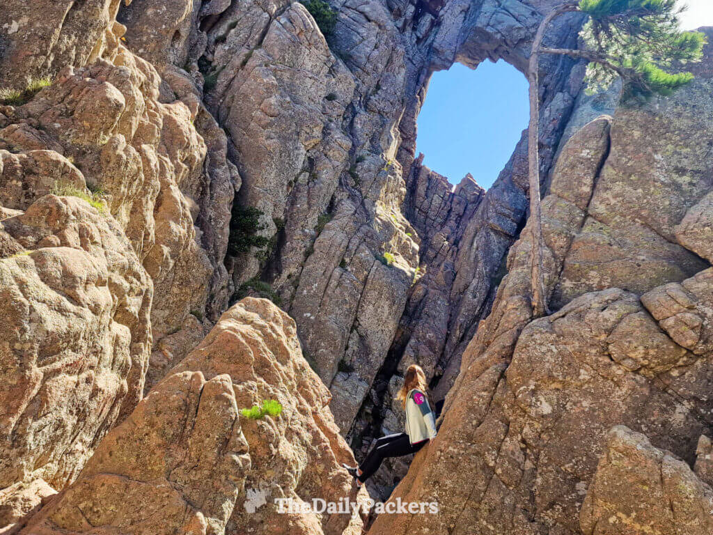 The famous Trou de la Bombe rock formation with a large natural hole in Corsica.