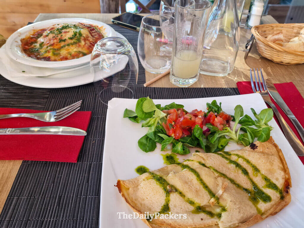 A savory crepe with pesto and side salad served at Cook in Casa restaurant near Porto-Vecchio.