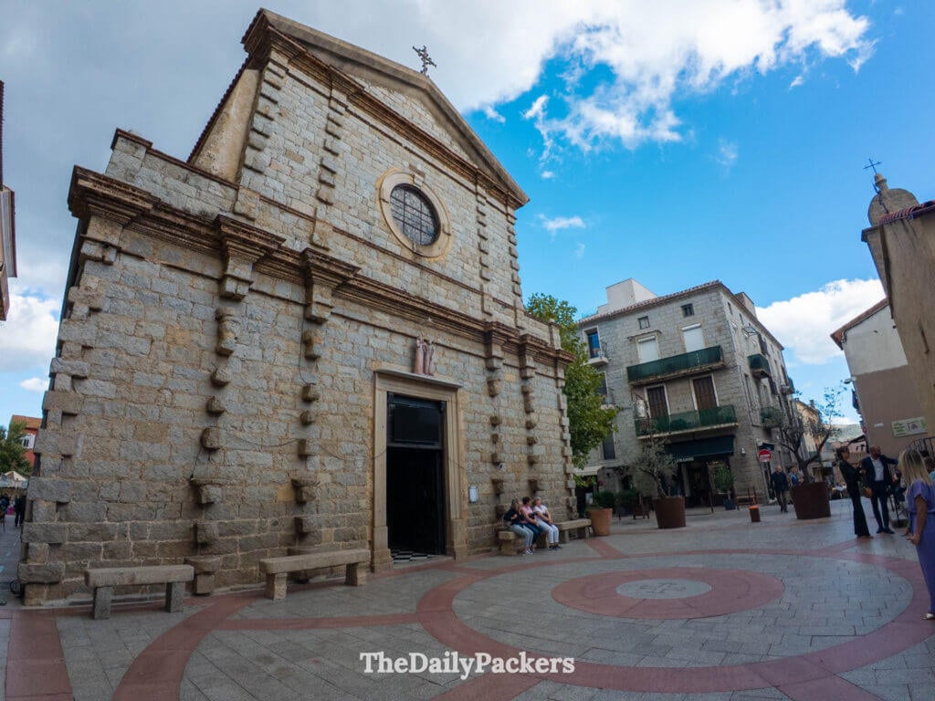 The historic stone facade of Saint-Jean-Baptiste Church in the old town of Porto-Vecchio.