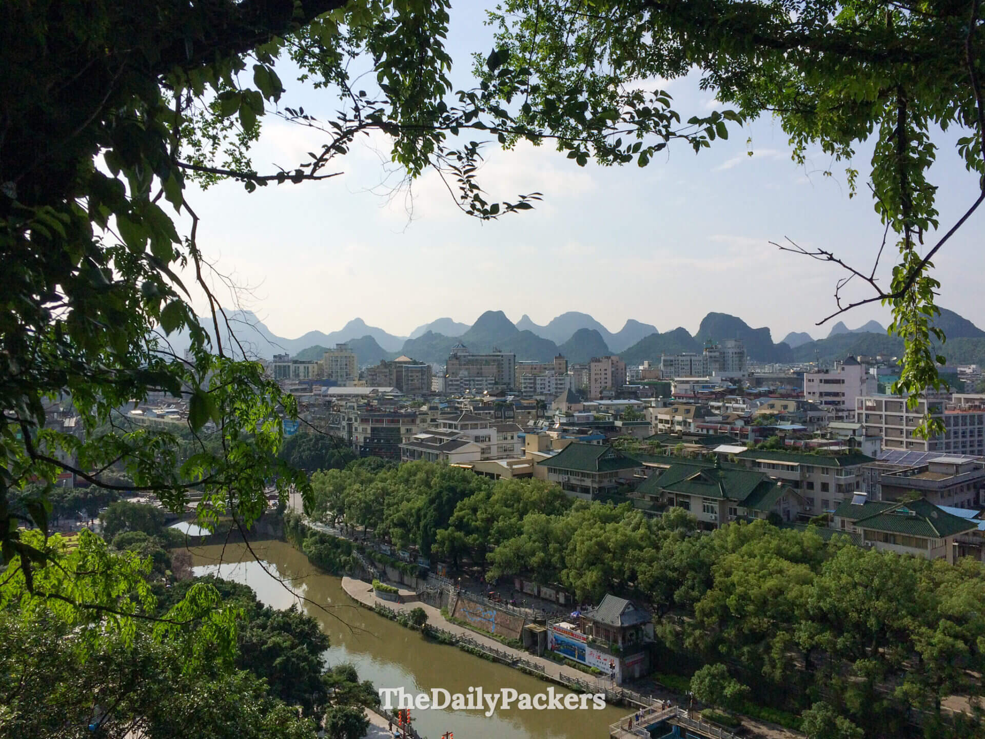 Li River winds through Guilin with jagged karst mountains on the horizon