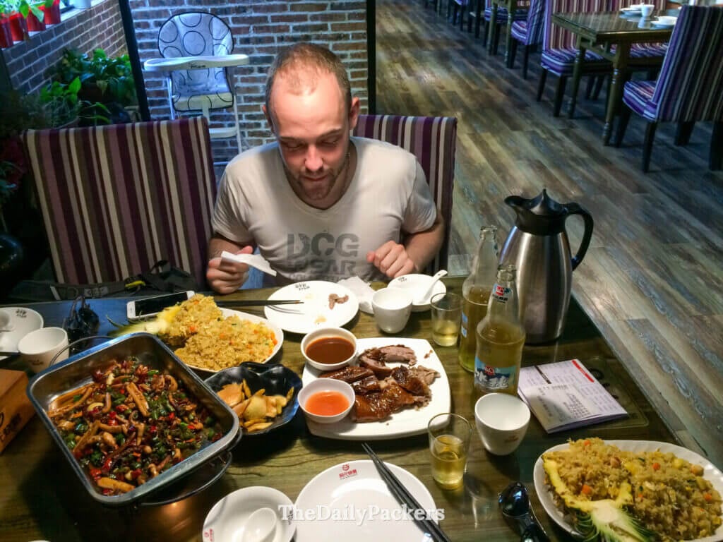 Guilin dinner spread with roast duck, fried rice and local Guangxi dishes.