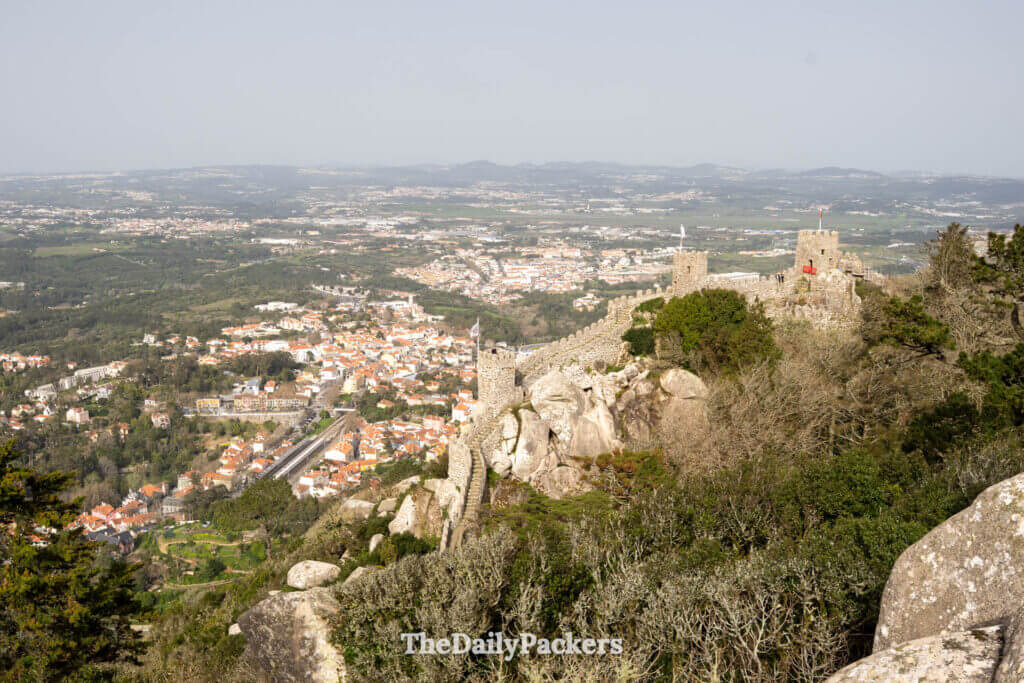 Panoramic view of the Sintra town landscape stretching below the ancient Moorish Castle walls.