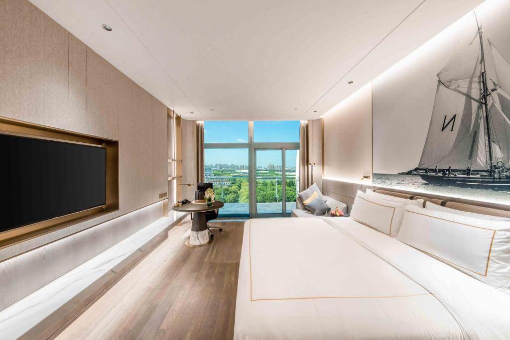 Spacious modern luxury room with city views and king bed at Suzhou's Crowne Plaza hotel