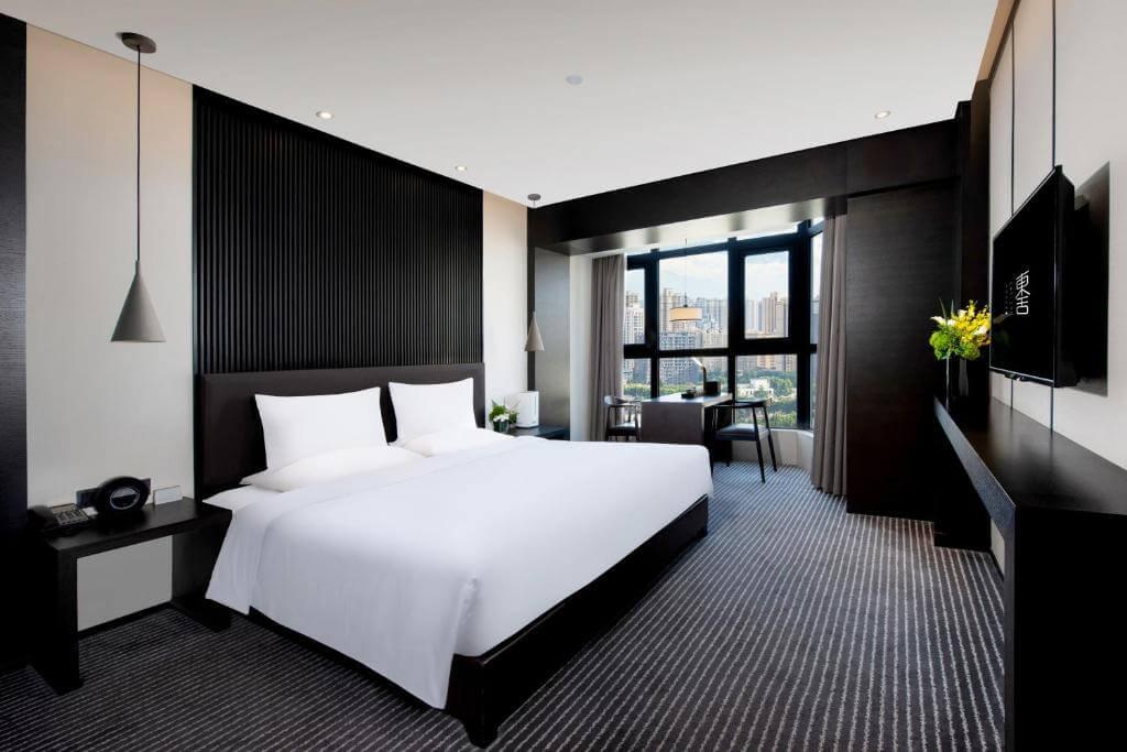 Modern black and white bedroom suite at Eastern House hotel, Xi'an